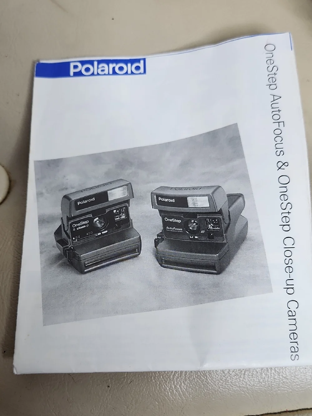 Polaroid OneStep Autofocus 600 instant film camera W/ instruction Manual